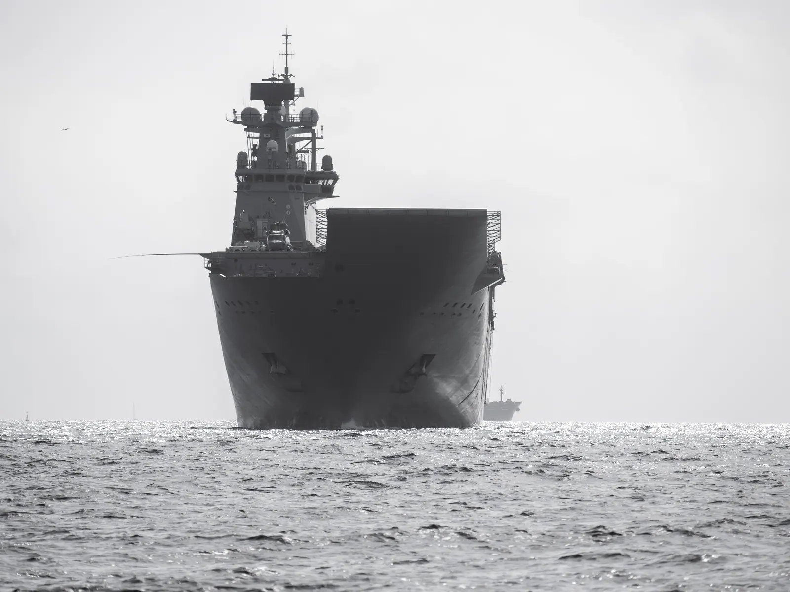 Aircraft carrier at sea in black and white