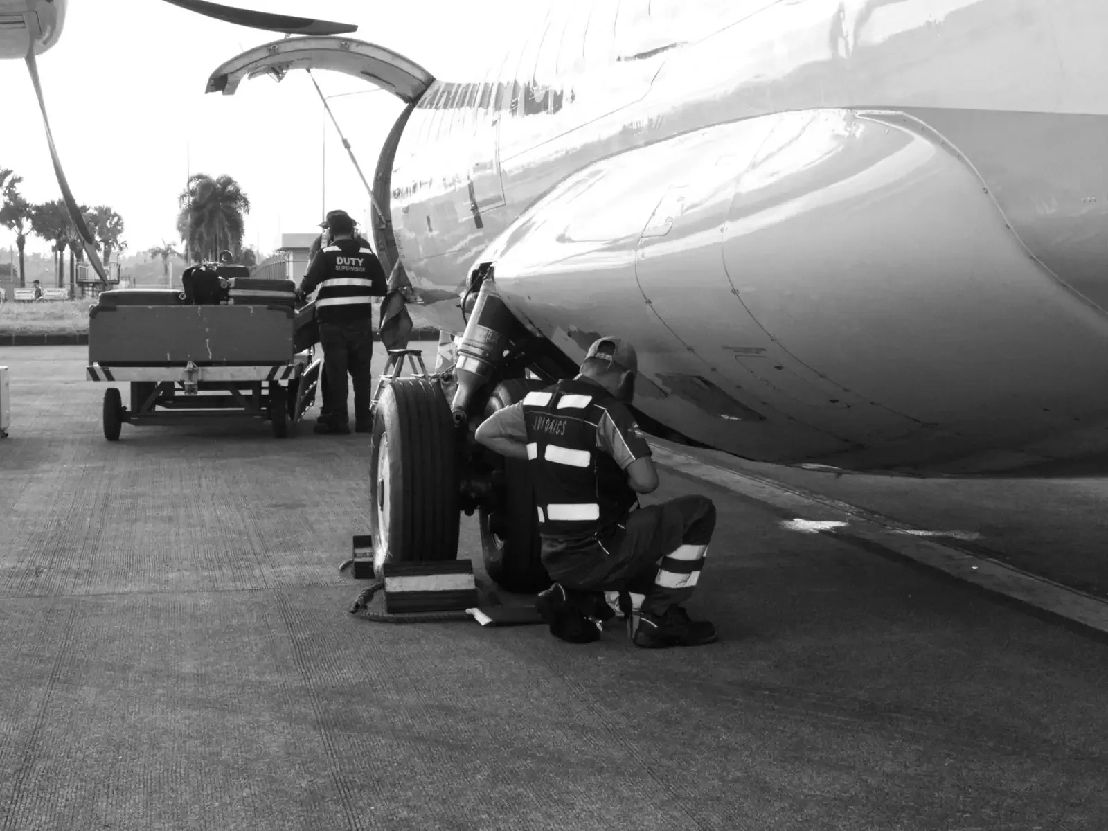 Maintenance crew working on an aircraft on the flight line