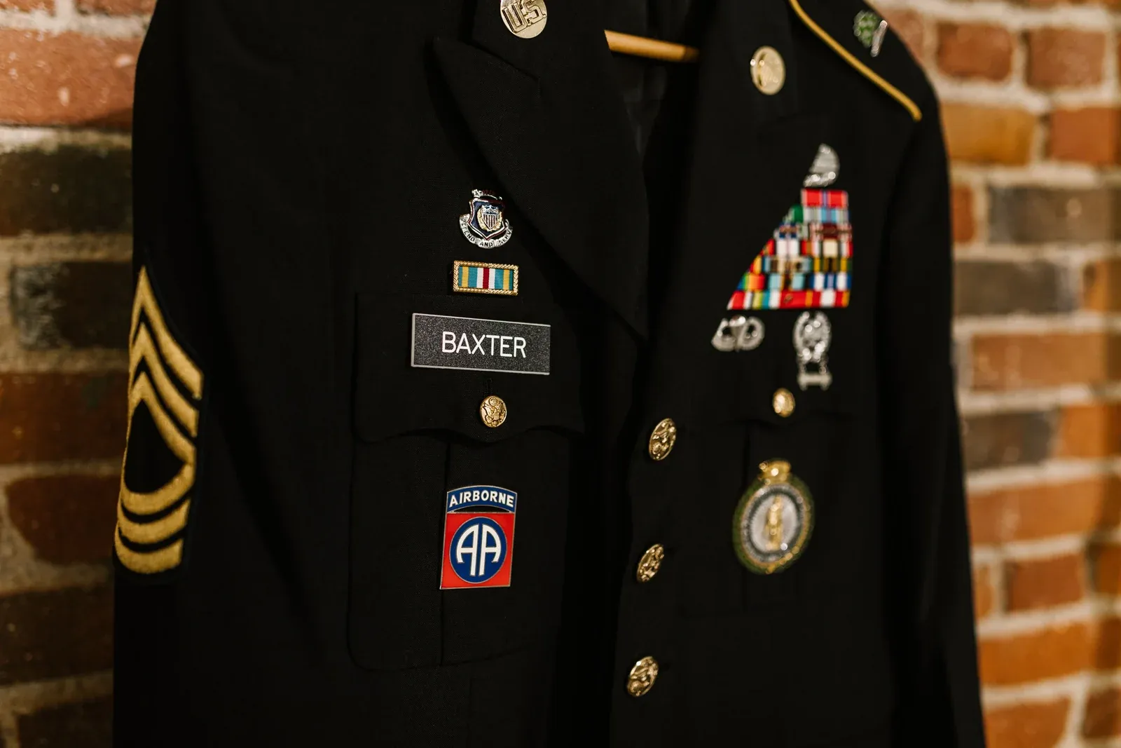 Army Service Uniform jacket with sergeant chevrons, ribbons and an 82nd Airborne patch