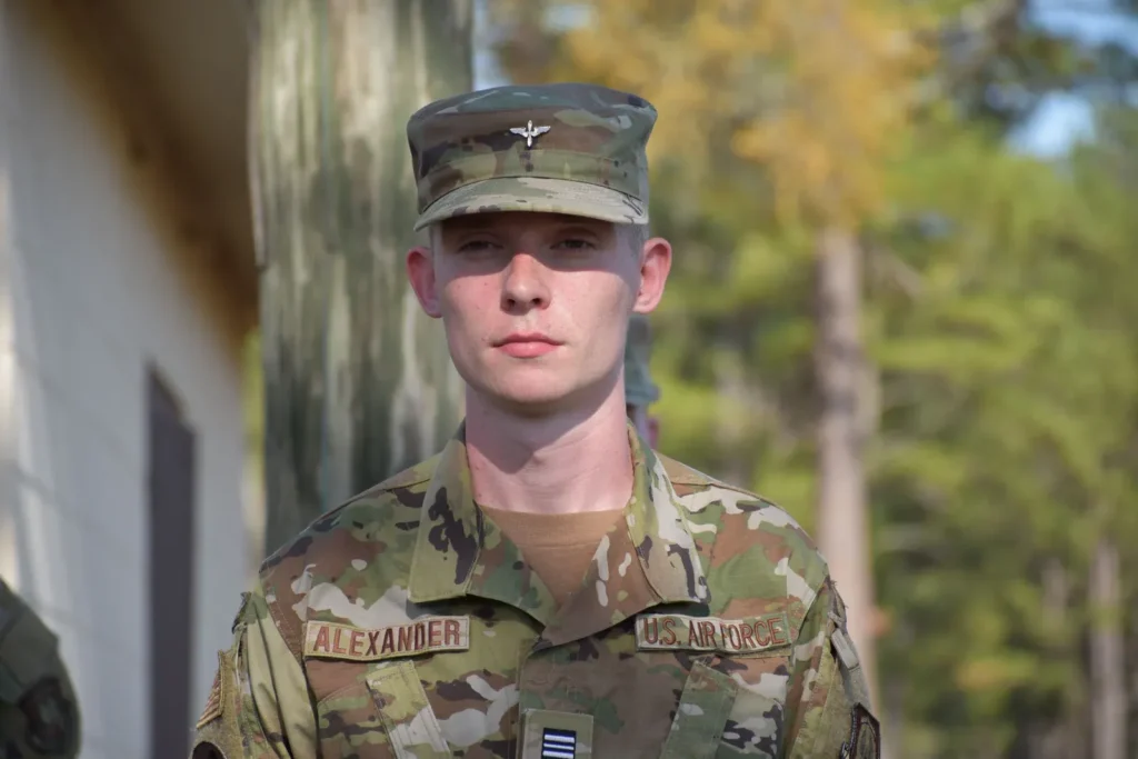 U.S. Air Force airman in an OCP uniform standing outdoors